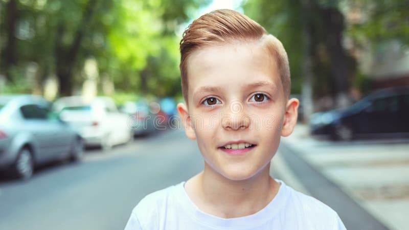 Portrait of happy boy with cool hipster haircut - Charming young casual smiling kid with trendy hairstyle