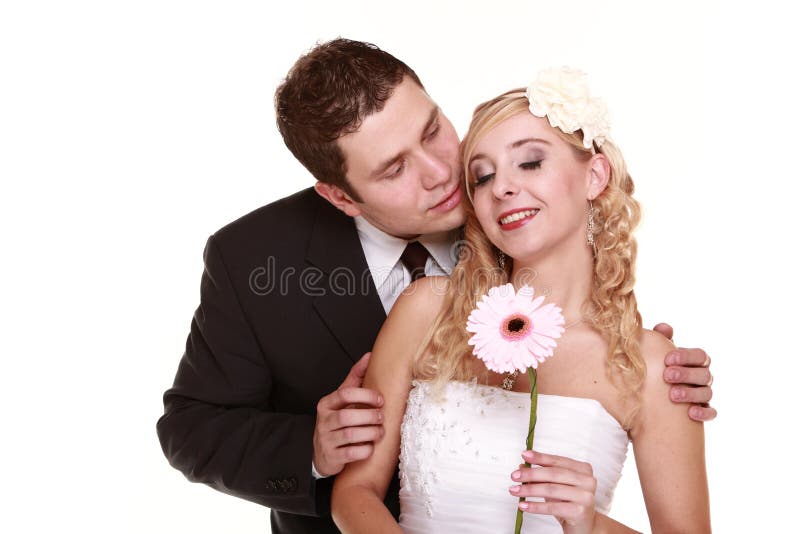 Portrait of happy bride and groom on white background