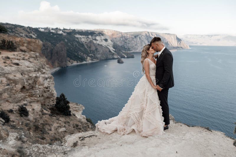 Portrait of a happy bride in luxury dress and groom, wedding love emotions