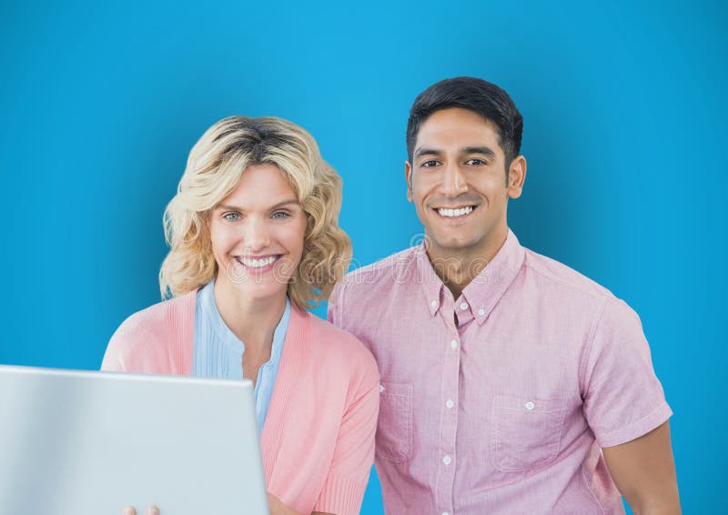Portrait of happy business people with laptop against blue background royalty free stock photography Portrait of happy business people with laptop against blue background royalty free stock photography
