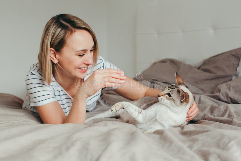 Woman Lying In Bedroom Smiling Stock Image Image Of