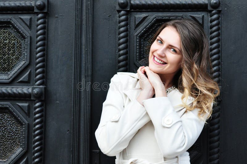 Portrait of happy cheerful beautiful young woman, outdoors