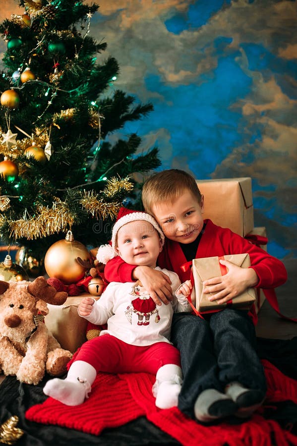 Portrait of Happy Children with Christmas Gift Boxes and Decorations ...