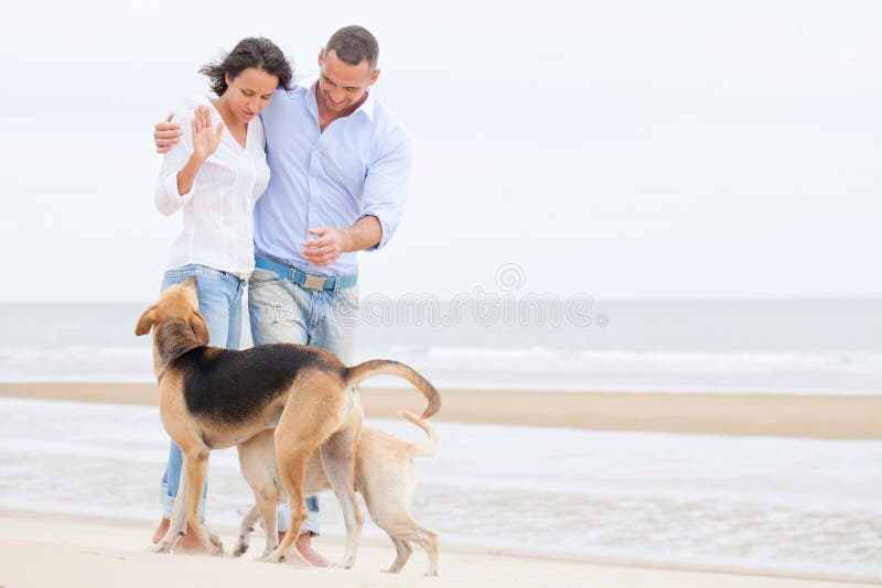 Portrait of a happy couple with dogs