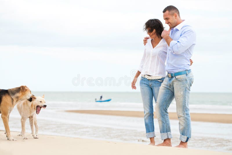 Portrait of a happy couple with dogs