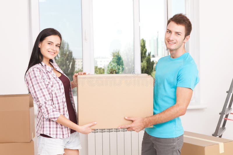 Portrait Of Happy Couple In New Home Stock Image - Image of expressing