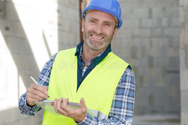 Portrait happy engineer gesturing outdoors royalty free stock photos