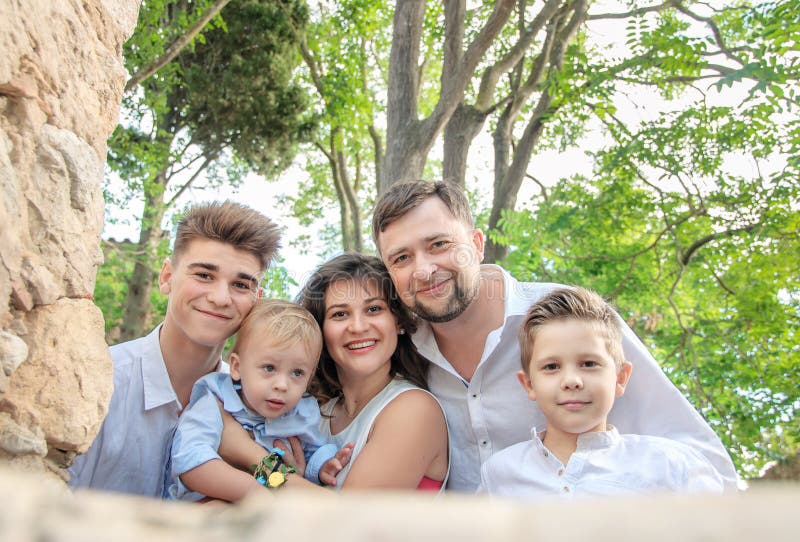 Portrait of a happy family in the park. Family concepts. stock photo Portrait of a happy family in the park. Family concepts. stock photo