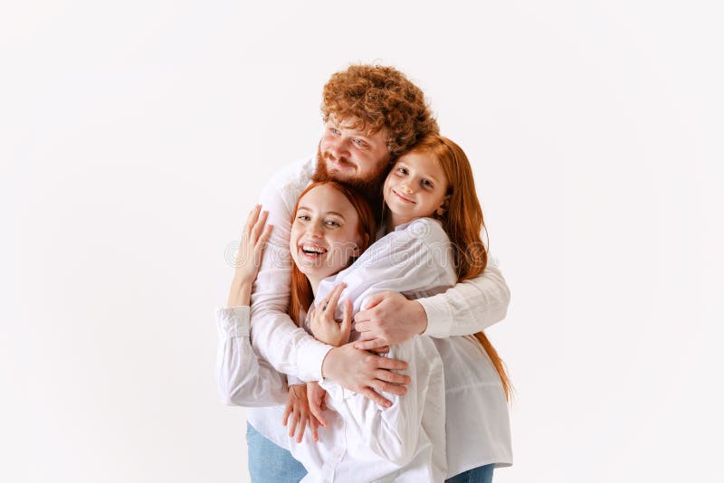 Portrait Of Happy Family Redhaired Parents And Kid In Casual Wear Look portrait-of-happy-family-redhaired-parents-and-kid-in-casual-wear-look