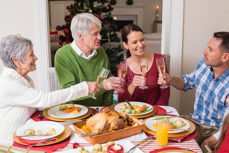 Portrait of Happy Family Toasting at Christmas Dinner Stock Photo