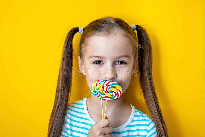 Portrait Of Happy Girl With Colored Sweet Lollipop On ...