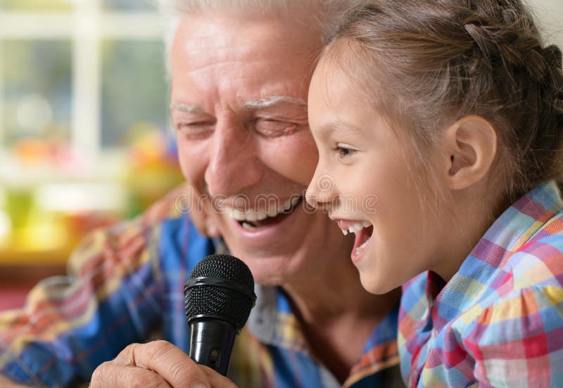portrait-happy-grandfather-child-singing-karaoke-grandfather-child-singing-karaoke-107083901.jpg