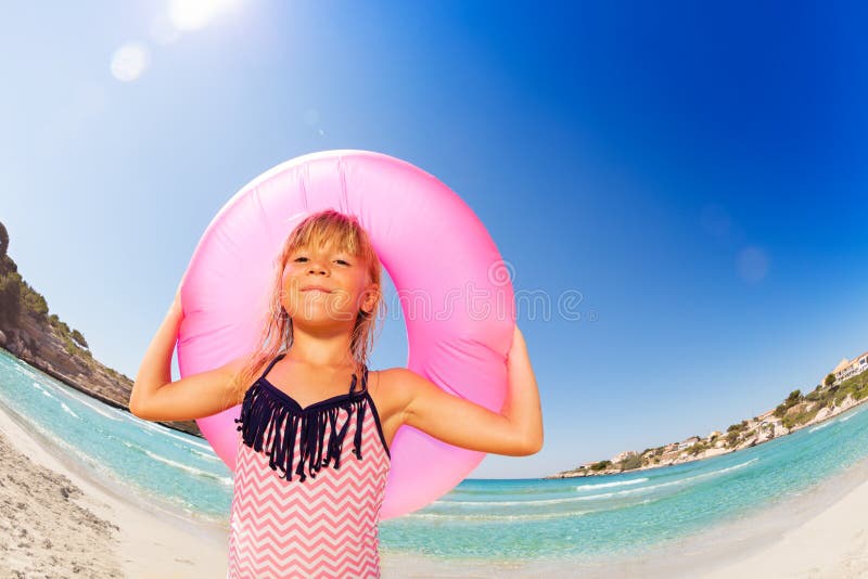 Happy Little Girl with Rubber Ring at the Seaside Stock Photo - Image ...