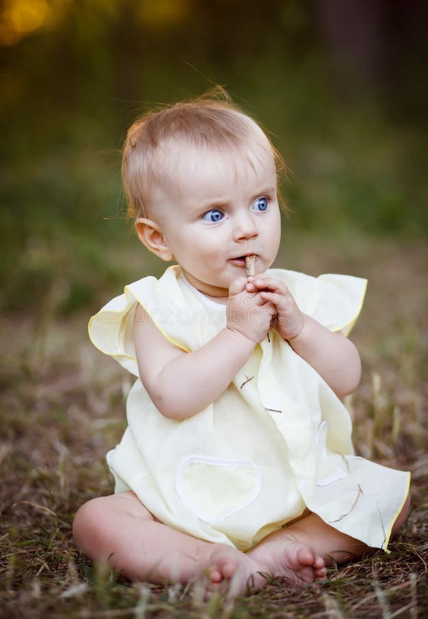 Portrait of a happy little girl in the park royalty free stock photography