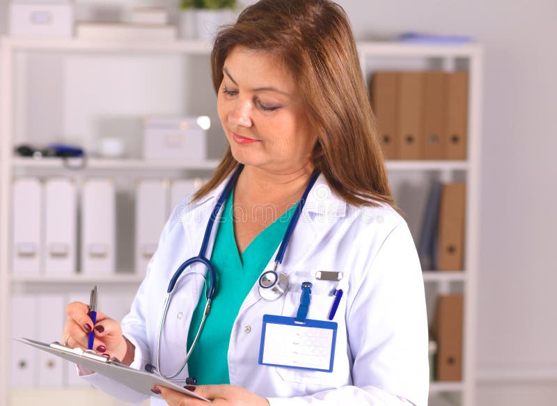 Portrait of happy medical doctor woman in office