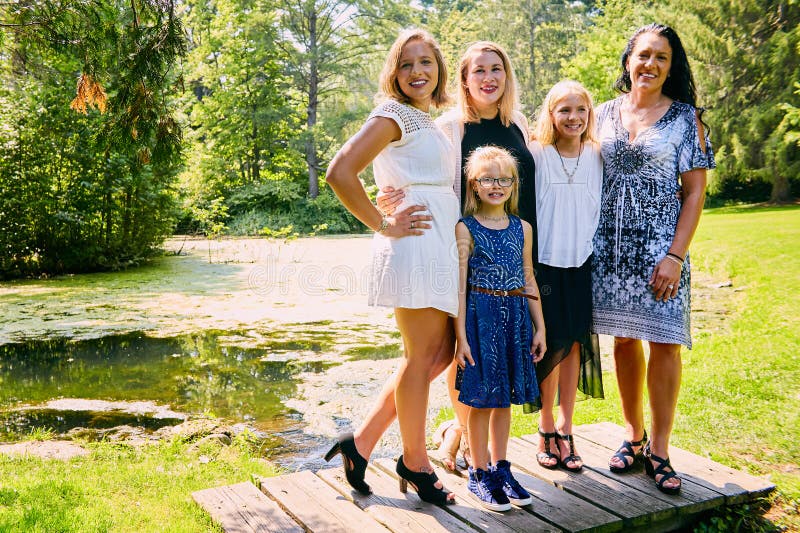 Portrait of happy mother posing with daughters stock images Portrait of happy mother posing with daughters stock images