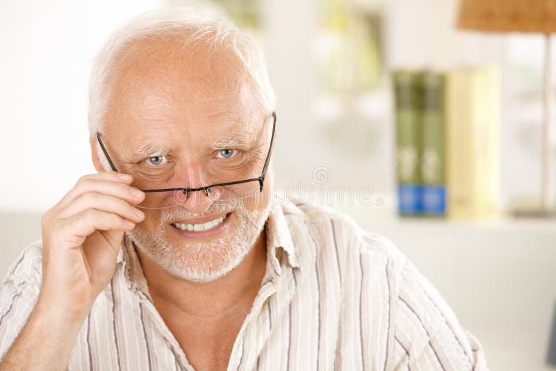 Portrait of happy older man wearing glasses