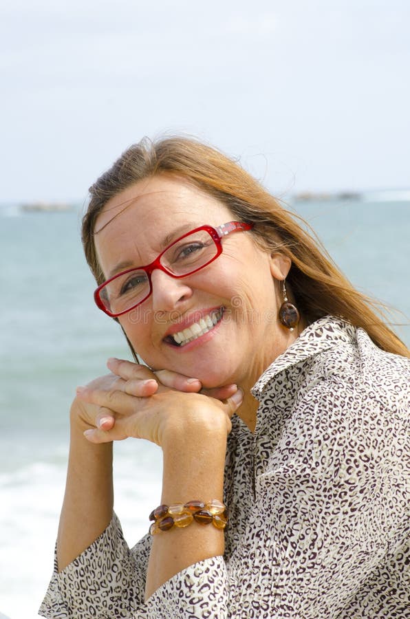 Portrait of happy and relaxed senior woman