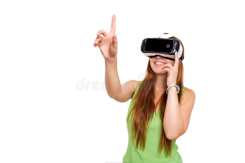 Portrait of happy smiling young beautiful girl getting experience using VR-headset glasses of virtual reality. Isolated