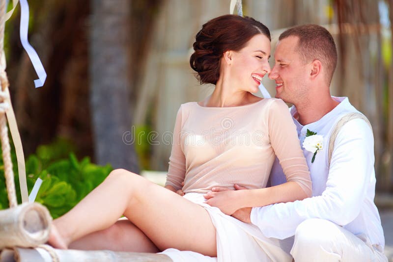 Portrait of happy wedding couple on tropical beach