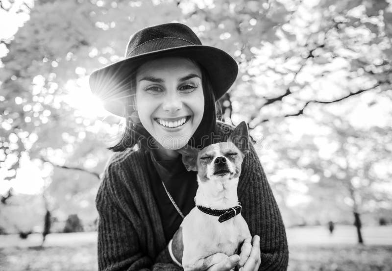 Portrait of happy woman with dog outdoors in autumn royalty free stock images Portrait of happy woman with dog outdoors in autumn royalty free stock images