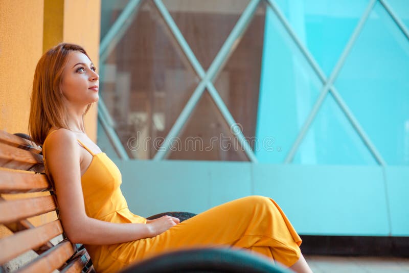 Portrait of a happy woman relaxing sitting on a bench outdoors stock image Portrait of a happy woman relaxing sitting on a bench outdoors stock image