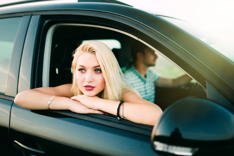 Portrait of Happy Young Woman Going on a Road Trip Leaning Out of ...