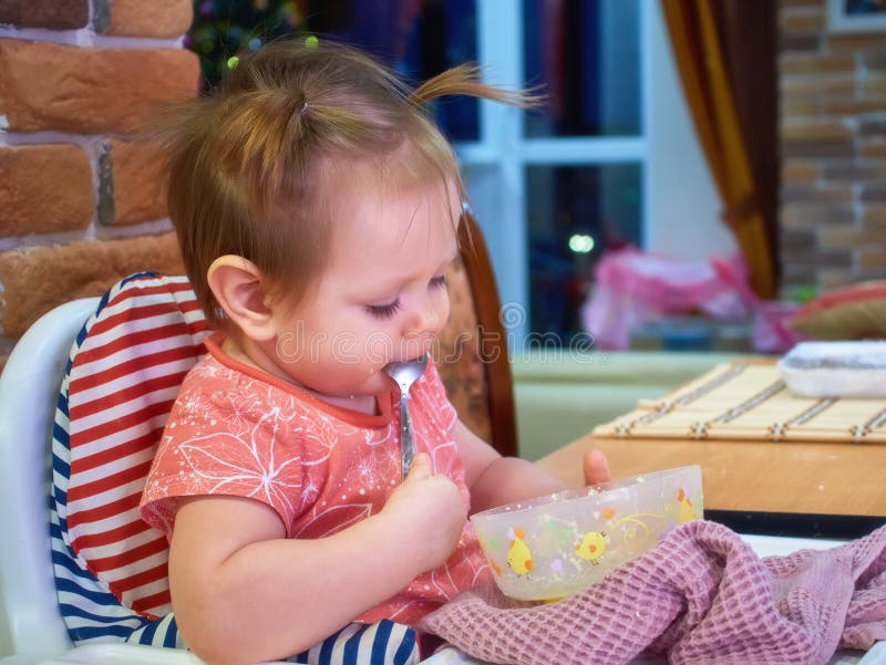 Portrait Of Happy Young Baby girl with cup