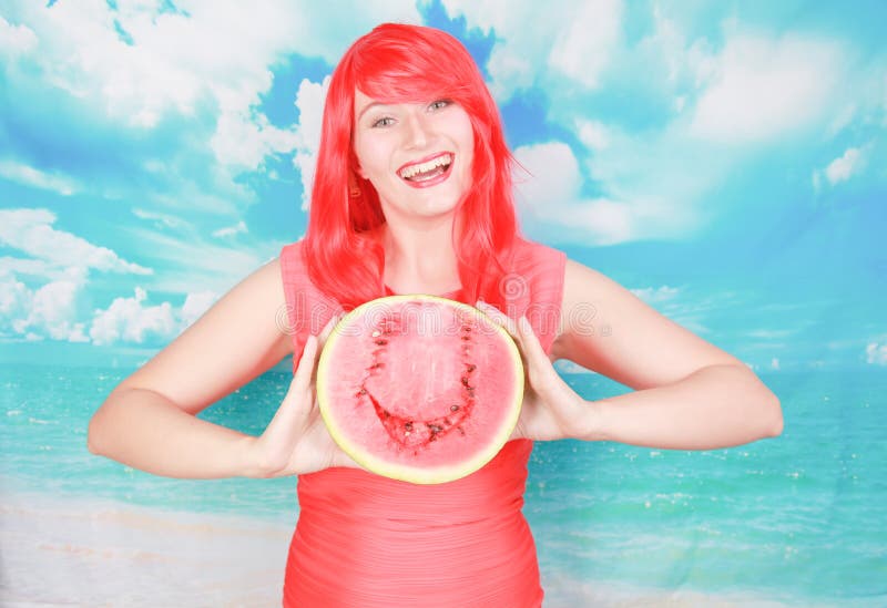 Portrait of happy young bright woman holding slice half of watermelon over colorful blue background stock photos Portrait of happy young bright woman holding slice half of watermelon over colorful blue background stock photos