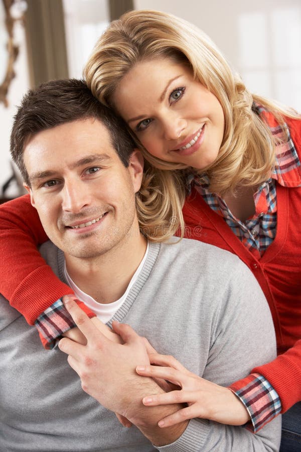 Portrait Of Happy Young Couple At Home