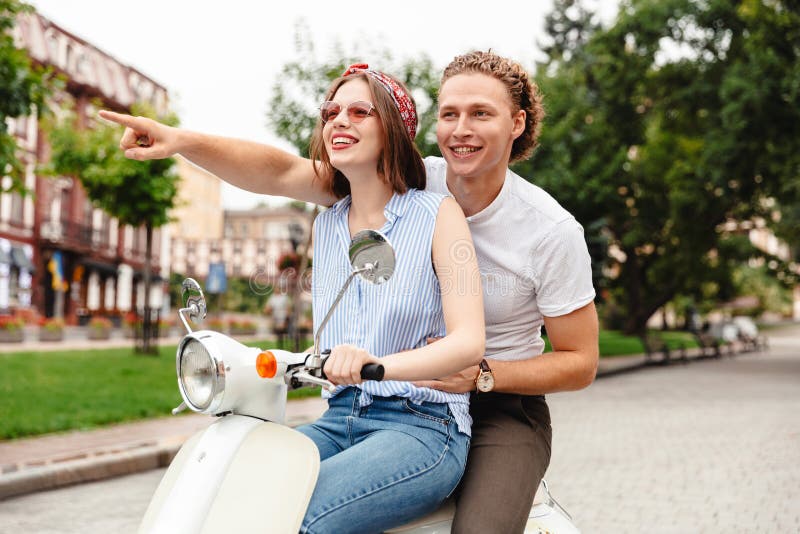 Portrait of a Happy Young Couple Riding on a Motorbike Stock Image ...