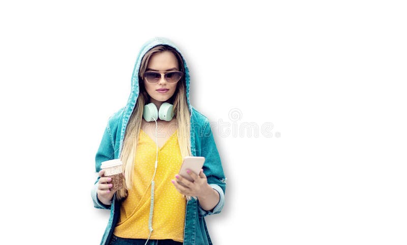 Portrait of a happy young girl using smart phone isolated on white. Young woman with headphones and sunglasses drinking coffee stock photos Portrait of a happy young girl using smart phone isolated on white. Young woman with headphones and sunglasses drinking coffee stock photos