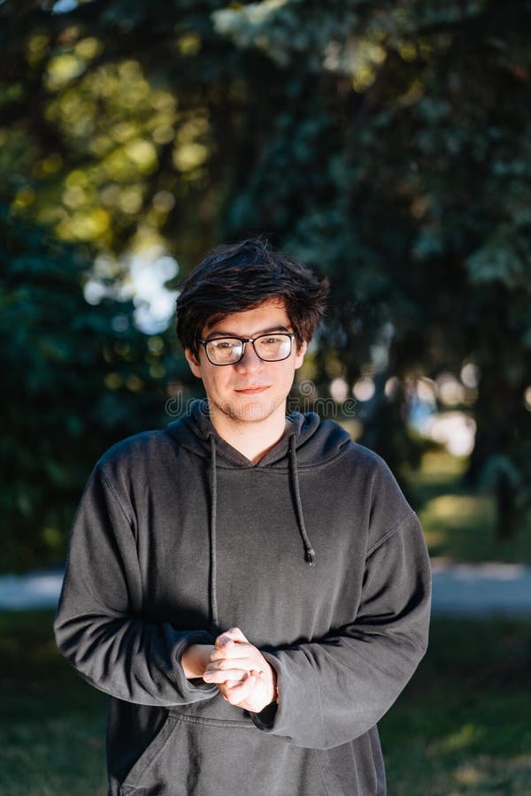 Portrait of Happy Young Male Student with Glasses in Casual Outfit ...