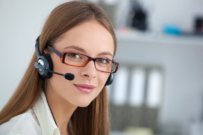 Portrait of happy cheerful beautiful young support phone operator with headset. Portrait of happy cheerful beautiful young support phone operator with headset.