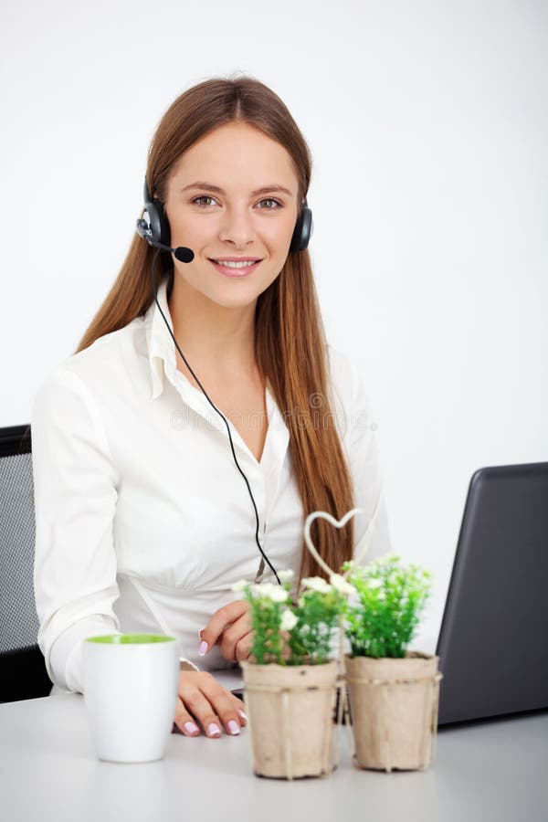 Portrait of happy cheerful beautiful young support phone operator with headset. Portrait of happy cheerful beautiful young support phone operator with headset.