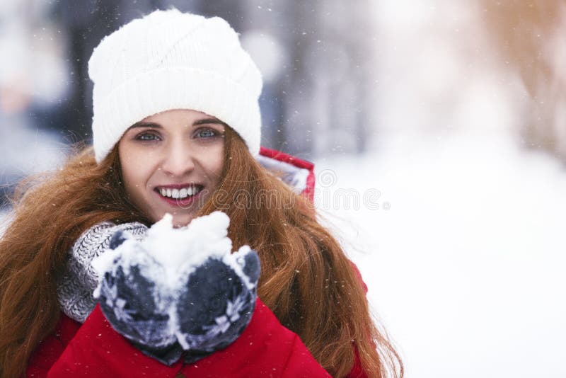 Portrait of Happy Young Woman Holding Snow in Her Hands Stock Photo ...