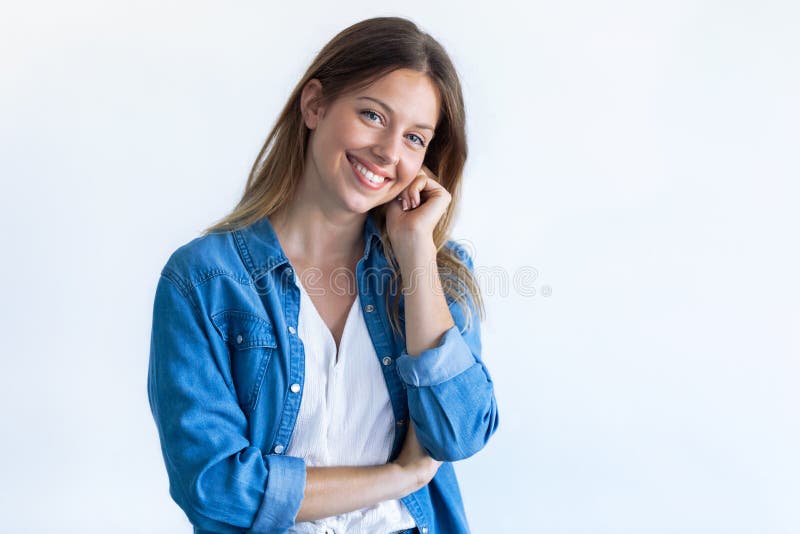 Happy young woman with perfect smile looking at camera. Isolated on white background