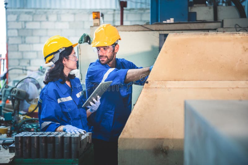Portrait of Heavy Industry Workers Working on the Metal Fabrication