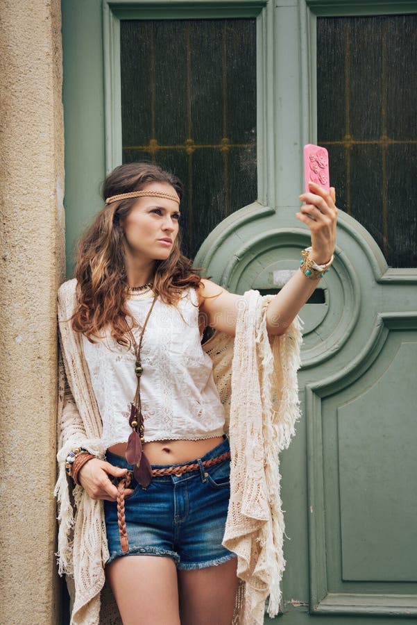 Portrait of Hippy-looking Woman Standing Outdoors Against Door Stock ...