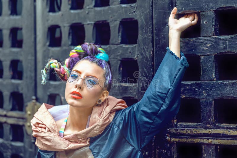 Portrait of hipster street fashion model woman with crazy braided hair and trendy funky glasses royalty free stock images Portrait of hipster street fashion model woman with crazy braided hair and trendy funky glasses royalty free stock images