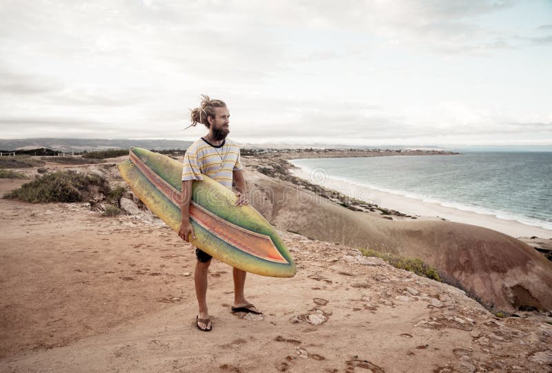 Portrait of Hipster Surfer with Dreadlocks and Beard Looking at the ...