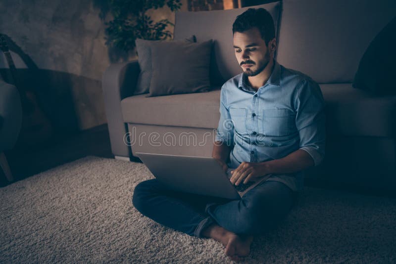 Portrait of his he nice attractive focused brunet guy sitting on floor working remotely overwork developing digital royalty free stock photos
