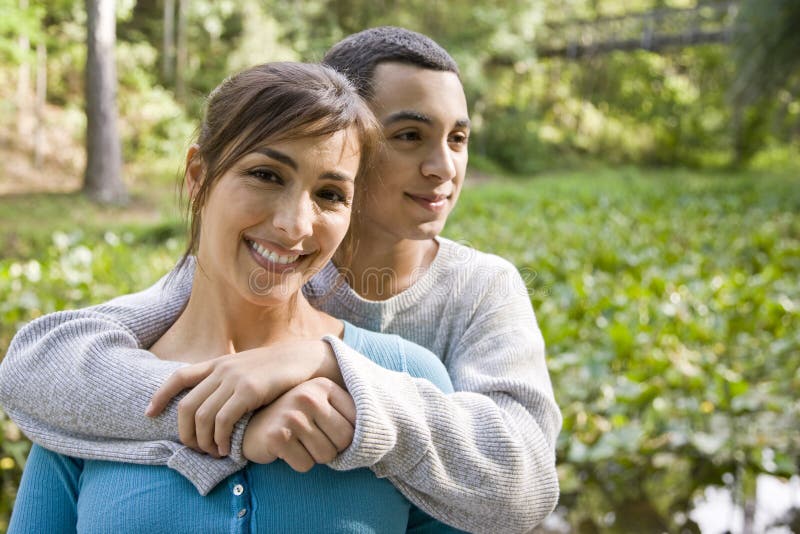 Portrait of Hispanic mother and teen son outdoors