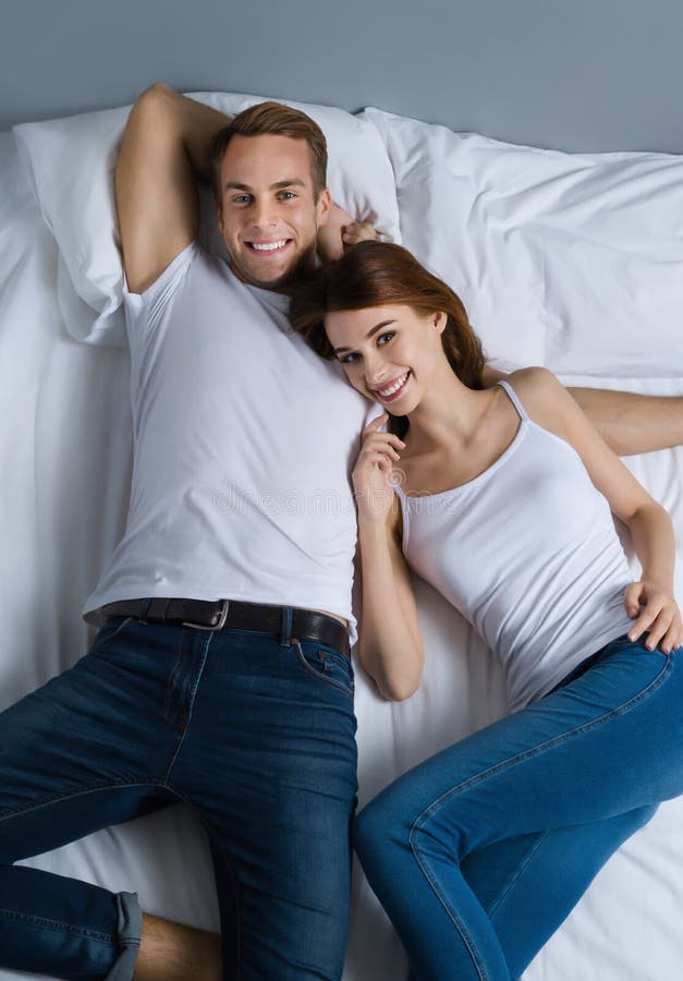 Young Happy Couple On The Bed In Love Relationship Dating Happy People Bedtime Stock Image