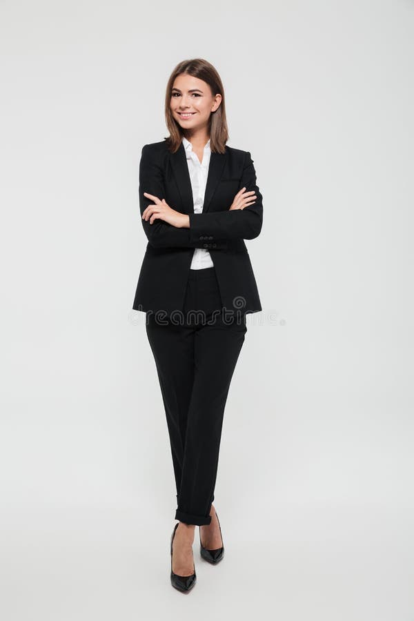 Portrait intégral d'une femme d'affaires de sourire attirante image libre de droits Portrait intégral d'une femme d'affaires de sourire attirante image libre de droits