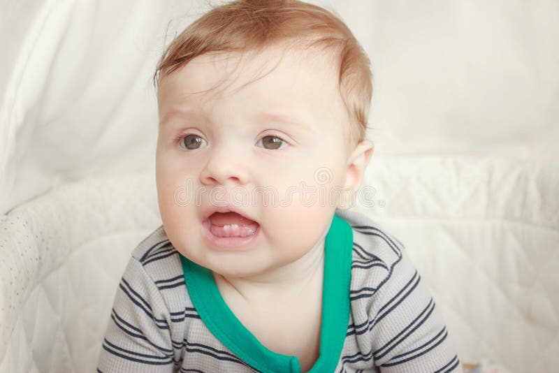 Portrait Of Joyfil Happiness Baby In The Bedroom Blurred Background