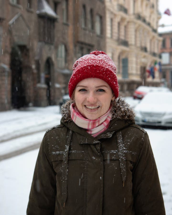 Portrait joyful young woman with blond hair having fun on street full with snow royalty free stock photo Portrait joyful young woman with blond hair having fun on street full with snow royalty free stock photo