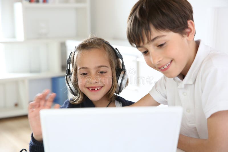 Very happy child playing game online with laptop stay at home. Asian boy  student online learning class study online video call teacher Stock Photo -  Alamy