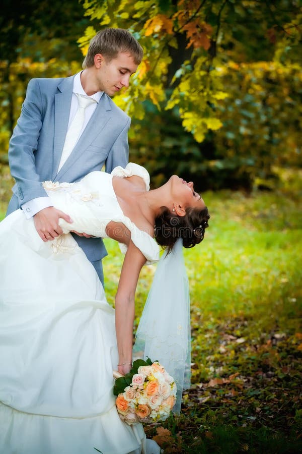 Portrait of kissing newlyweds stock photo