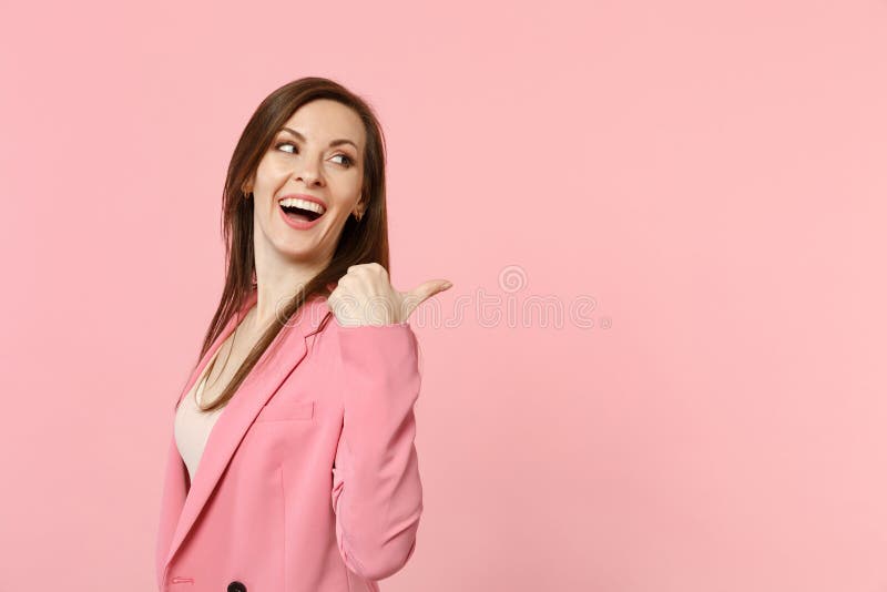 Portrait Of Laughing Funny Young Woman Wearing Jacket Looking Pointing Thumb Aside Isolated On 